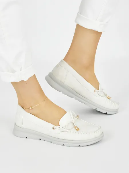 White comfortable moccasins made of eco-leather