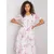 White dress with floral patterns.