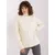 Ecru women's turtleneck sweater with cables.