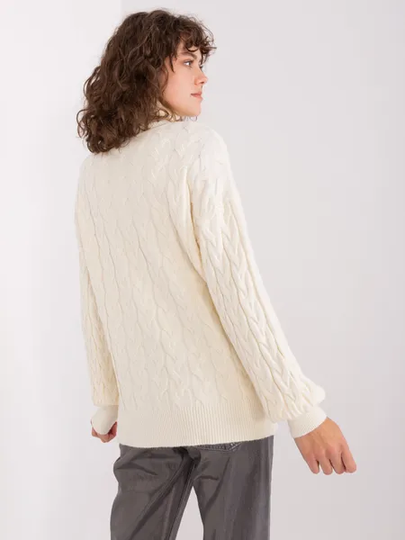 Ecru women's turtleneck sweater with cables.