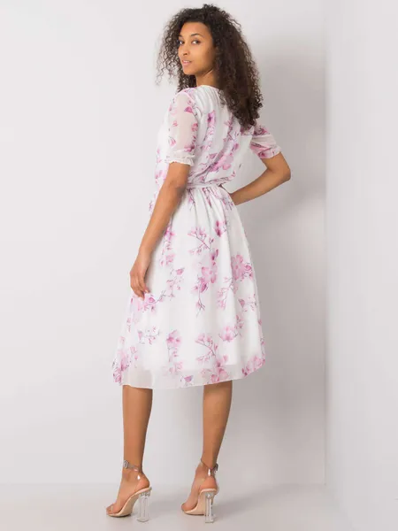 White dress with floral patterns.