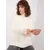 Ecru women's turtleneck sweater with cables.