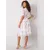White dress with floral patterns.