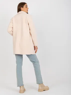 A light pink loose alpaca coat with pockets.
