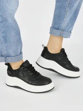 Women's black sneakers with a thick sole