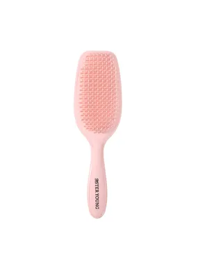 Ayla Hair Brush to comb the peach hair combing