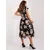 Women's black and beige dress with a print